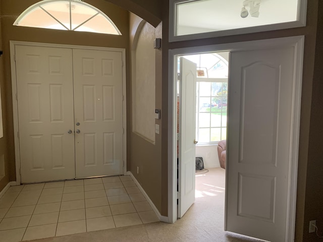 entrance foyer featuring light tile patterned floors