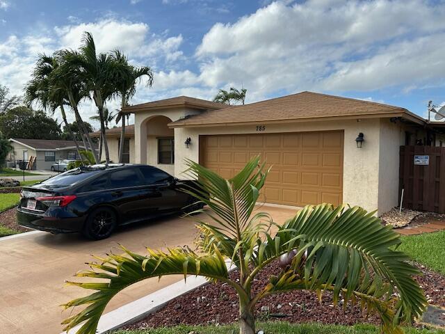 view of front of home featuring a garage