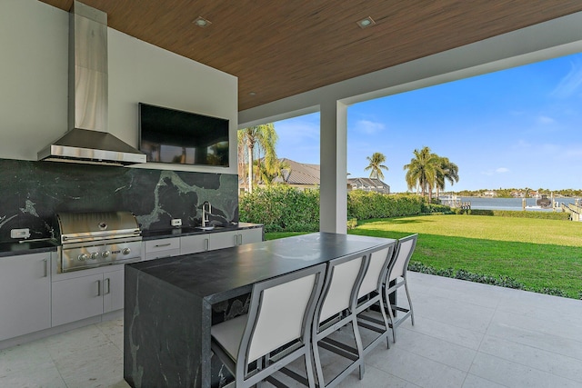 view of patio / terrace with sink, grilling area, and an outdoor kitchen