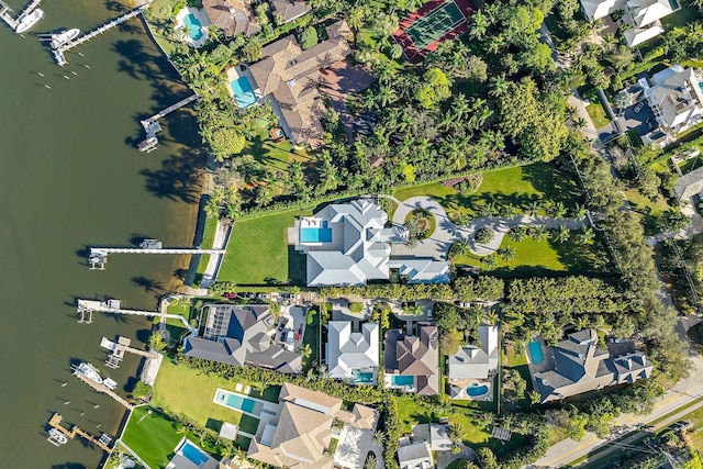 birds eye view of property featuring a water view and a residential view