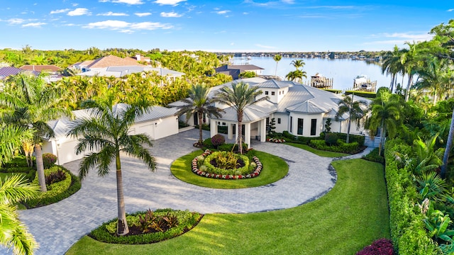 birds eye view of property with a water view