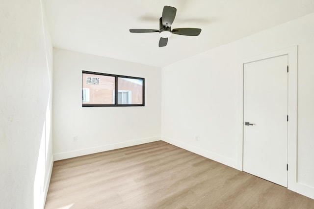 empty room featuring light hardwood / wood-style floors and ceiling fan