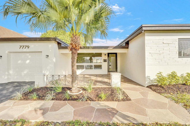 property entrance featuring a garage