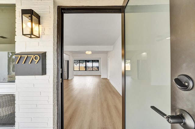 corridor featuring hardwood / wood-style floors