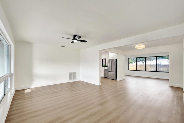 interior space featuring ceiling fan and light hardwood / wood-style floors