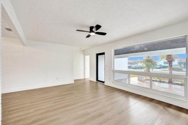 unfurnished room with ceiling fan and light hardwood / wood-style flooring