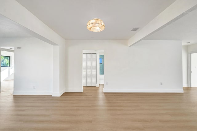 unfurnished room featuring light wood-type flooring