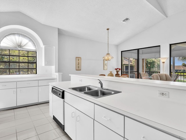 kitchen featuring sink, decorative light fixtures, dishwasher, white cabinetry, and lofted ceiling