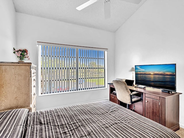 bedroom with ceiling fan and a textured ceiling