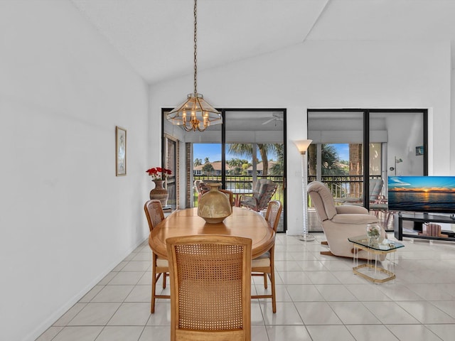 tiled dining area with vaulted ceiling and a notable chandelier