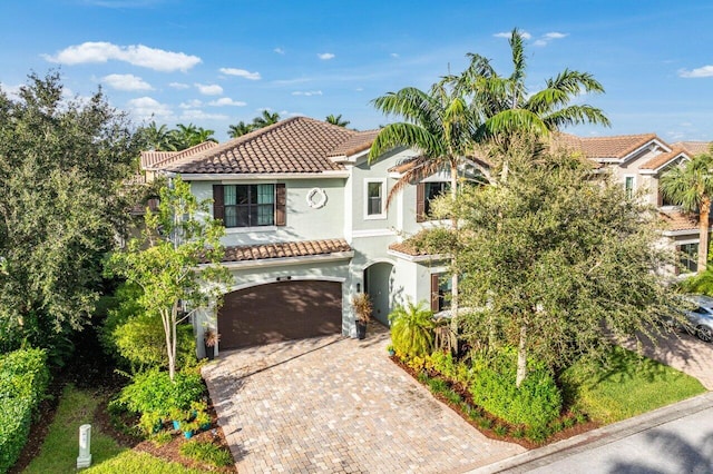 mediterranean / spanish-style house featuring a garage