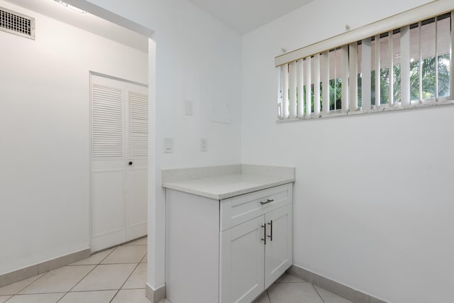 interior space with tile patterned floors