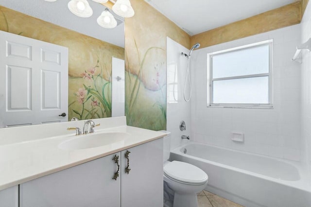 full bathroom with tile patterned flooring, vanity, toilet, and tiled shower / bath