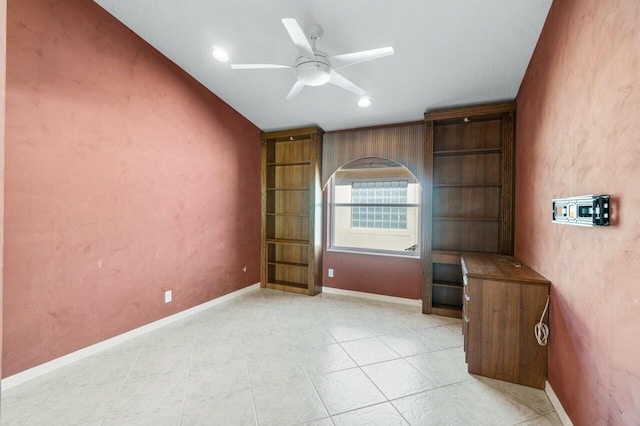 unfurnished office with ceiling fan