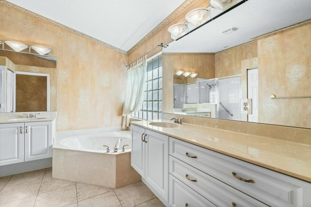 bathroom with tile patterned flooring, vanity, and independent shower and bath