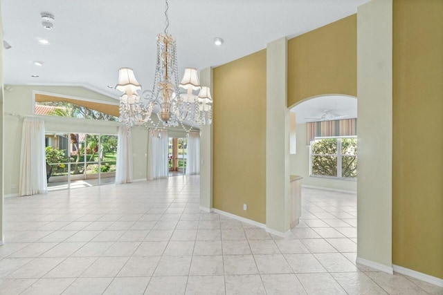 unfurnished room featuring light tile patterned floors, ceiling fan with notable chandelier, and vaulted ceiling