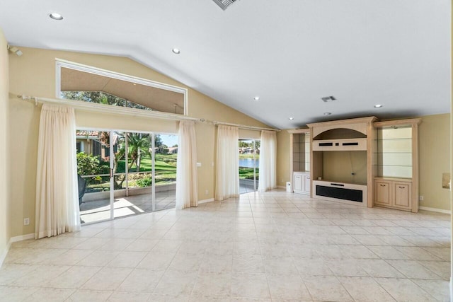 unfurnished living room featuring light tile patterned flooring and vaulted ceiling