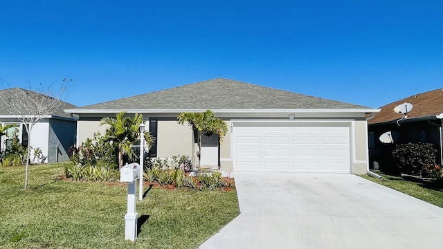 single story home with a front yard and a garage