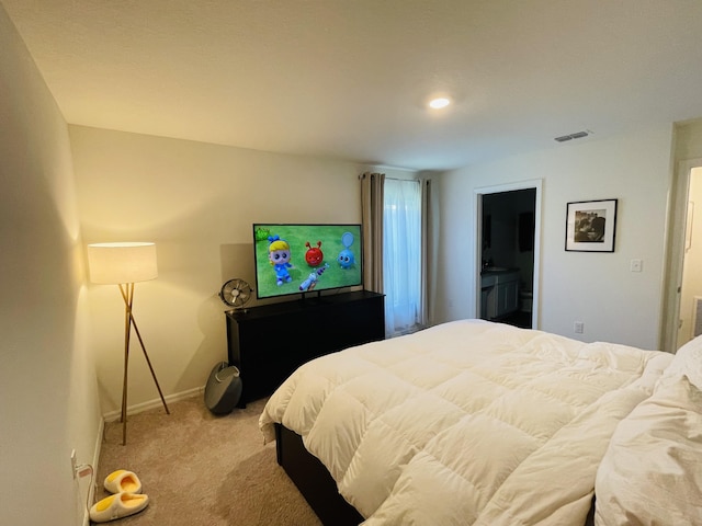 bedroom with light colored carpet