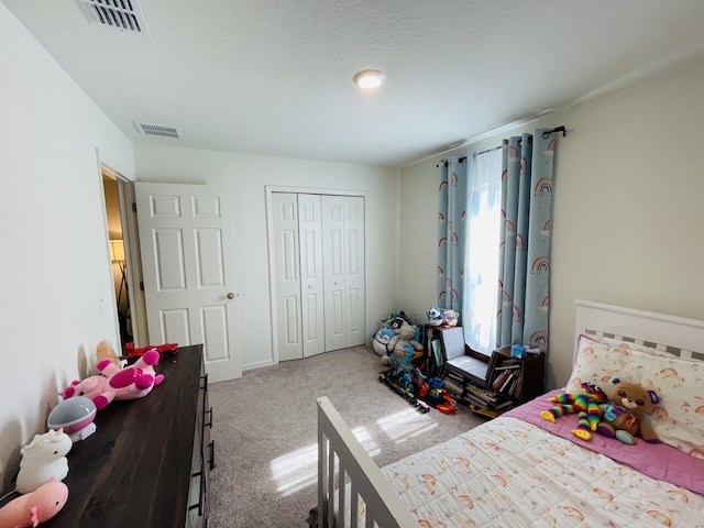 carpeted bedroom with a closet