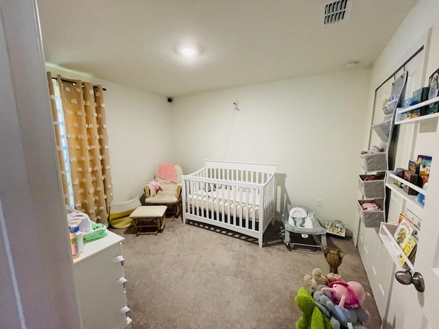 carpeted bedroom with a nursery area