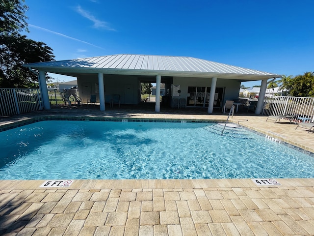 view of swimming pool featuring a patio area