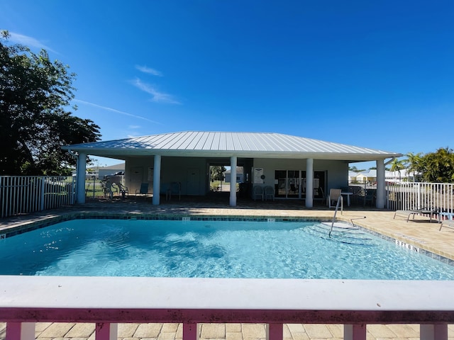 view of swimming pool featuring a patio area