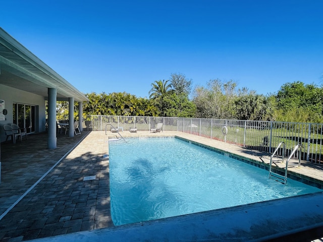 view of swimming pool featuring a patio area