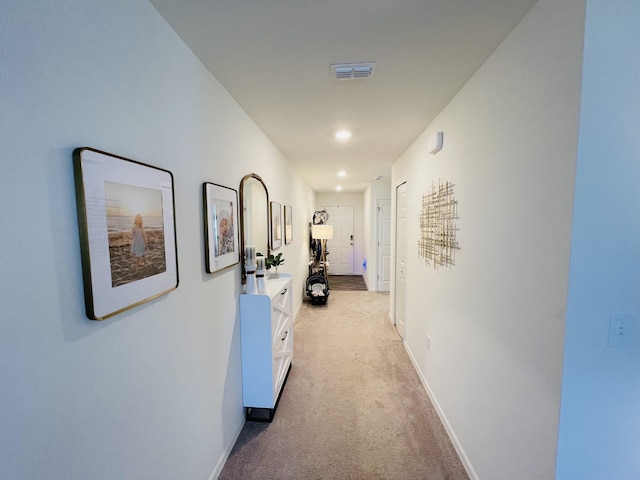 hallway with light carpet