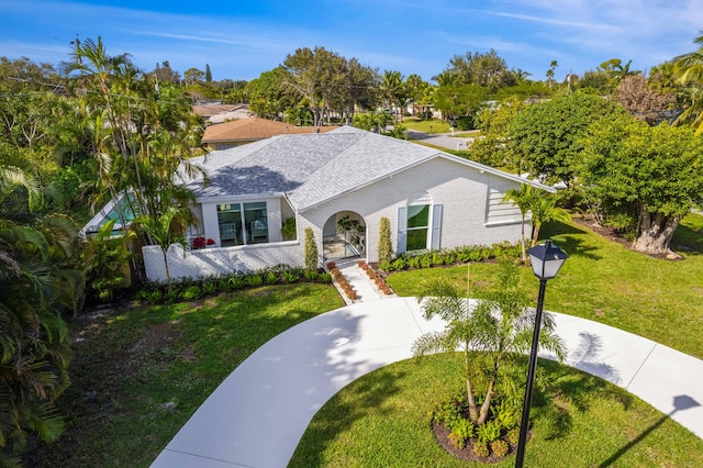 view of front of home with a front lawn