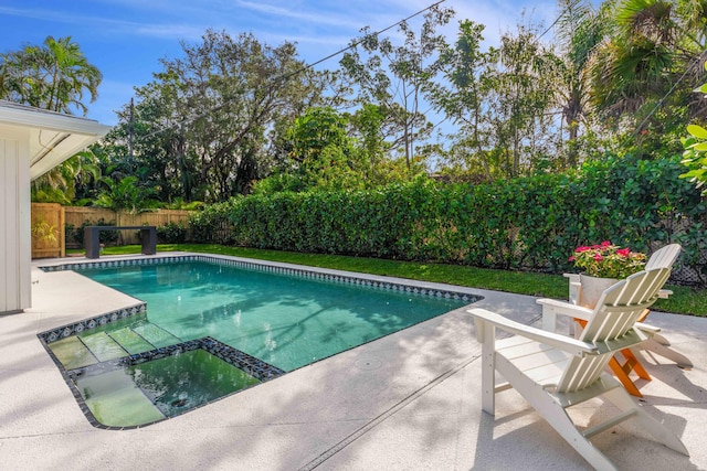 view of swimming pool with an in ground hot tub and a patio area