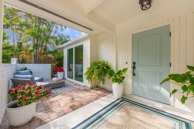 entrance to property with a patio