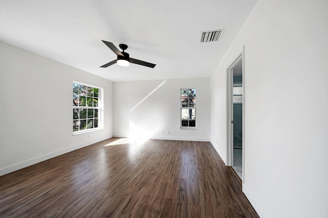 unfurnished living room with dark hardwood / wood-style floors, a textured ceiling, and ceiling fan