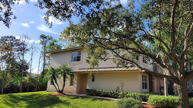 view of property exterior featuring a yard