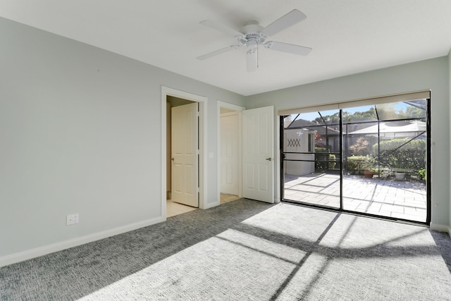 spare room with ceiling fan and light carpet