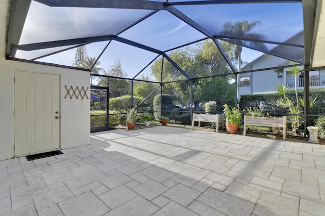 view of patio / terrace featuring a lanai