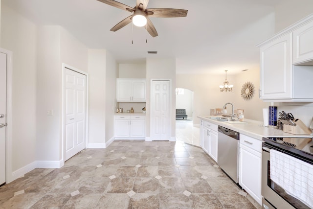 kitchen with visible vents, arched walkways, appliances with stainless steel finishes, white cabinetry, and a sink