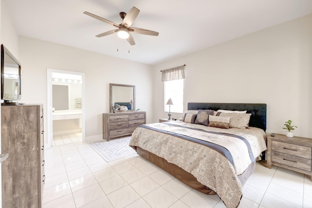 bedroom featuring ceiling fan, ensuite bathroom, and light tile patterned floors