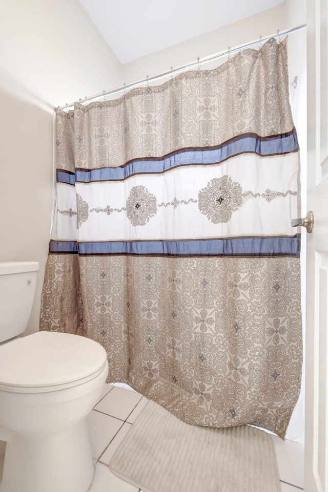 bathroom featuring toilet and tile patterned floors