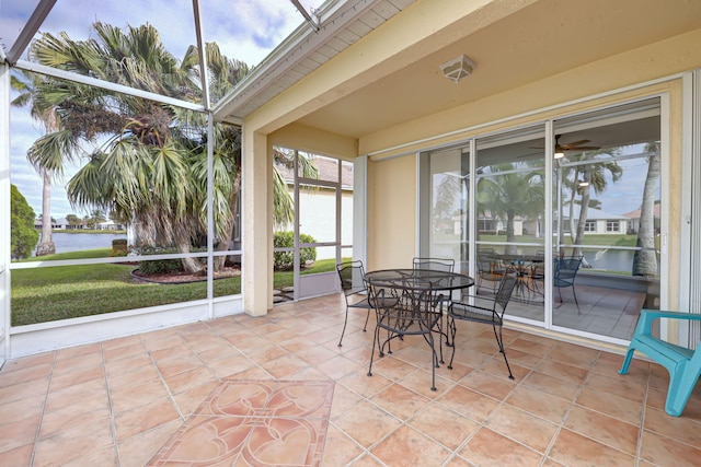 sunroom / solarium with a water view