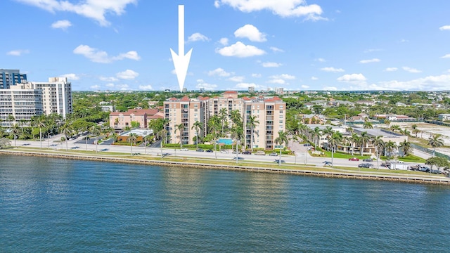 birds eye view of property with a water view