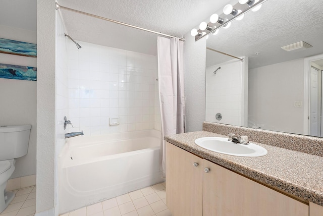 full bathroom featuring toilet, a textured ceiling, and tile patterned floors