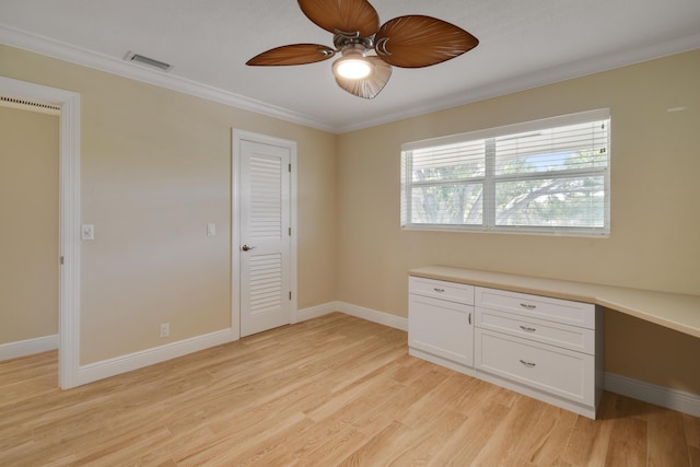 unfurnished bedroom with light wood-type flooring, built in desk, ceiling fan, and crown molding