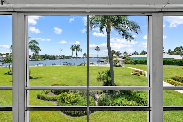 unfurnished sunroom featuring a healthy amount of sunlight and a water view