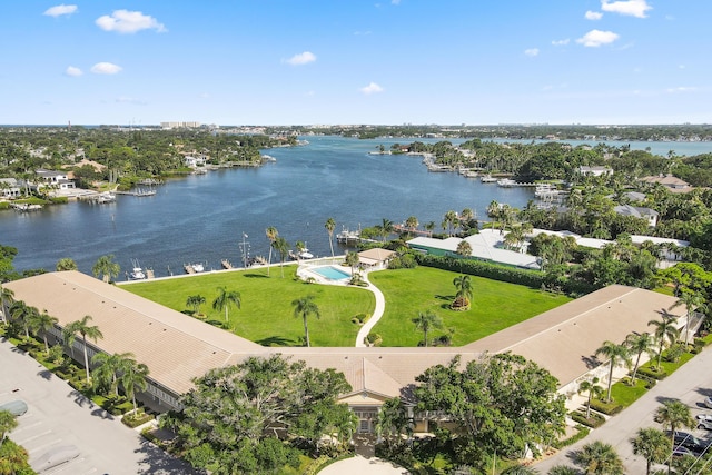 birds eye view of property with a water view