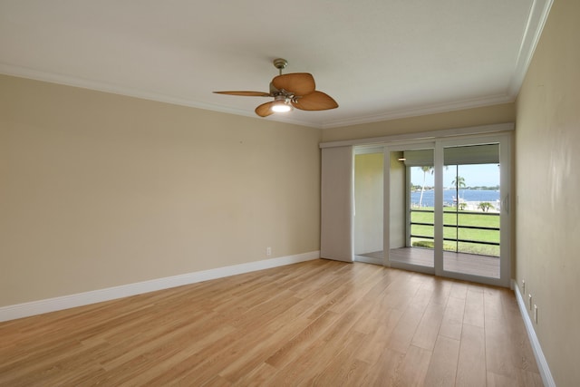 spare room featuring ceiling fan, light hardwood / wood-style flooring, and ornamental molding