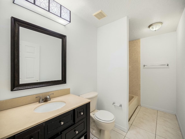 bathroom featuring tile patterned flooring, vanity, toilet, and a textured ceiling