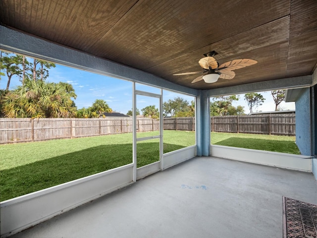 unfurnished sunroom featuring ceiling fan and wooden ceiling