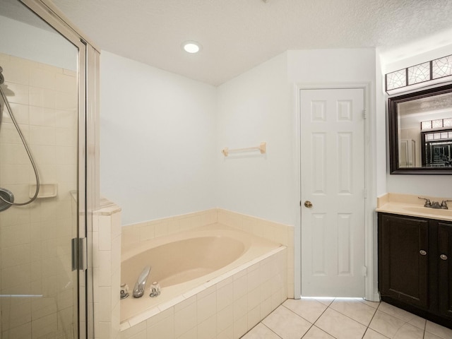 bathroom featuring vanity, tile patterned floors, and independent shower and bath