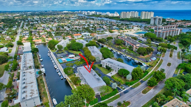 birds eye view of property featuring a water view